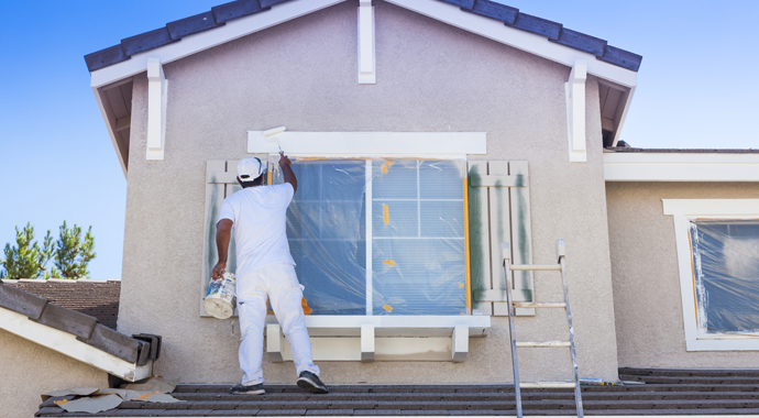Busy House Painter Painting the Trim And Shutters of A Home in Los Angeles
